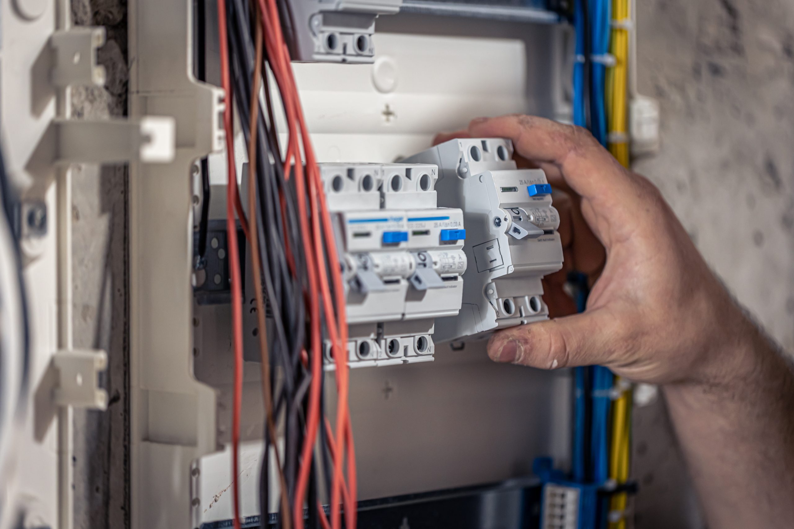 technician-changing-fuse-in-panel